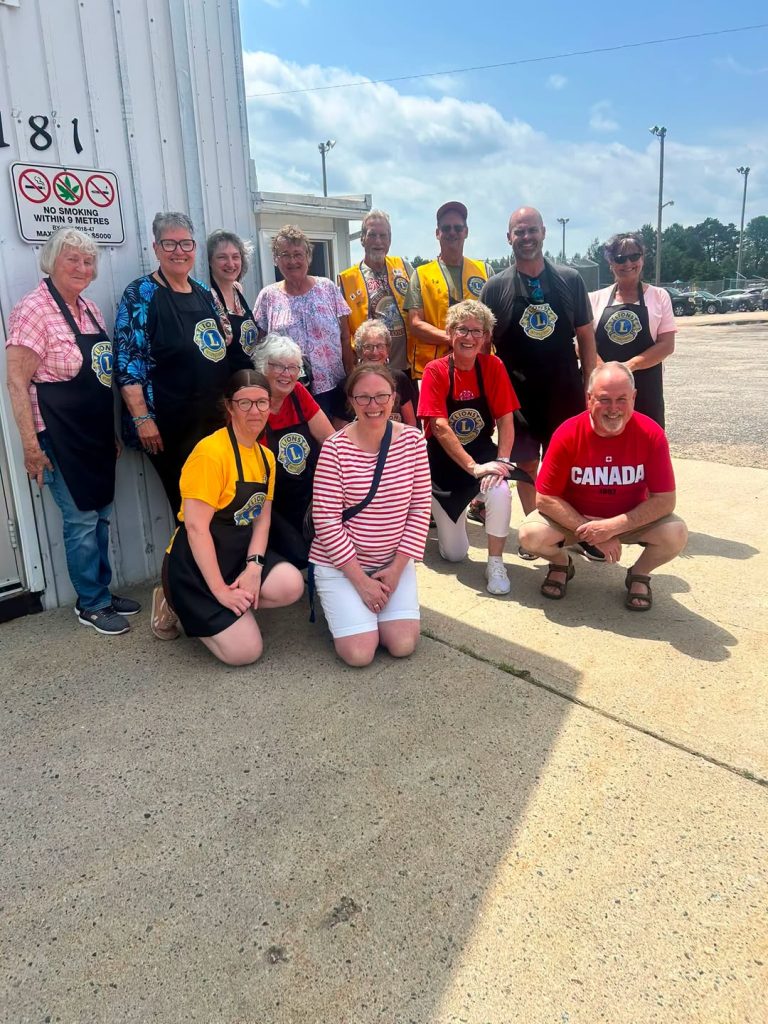 Trout Creek Lions Club members gathered together outside the Community Centre